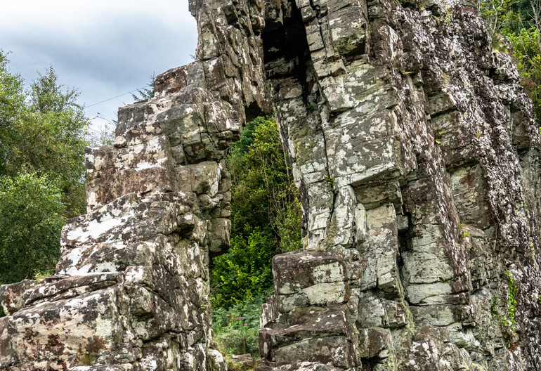  A stone rock formation next to the road
