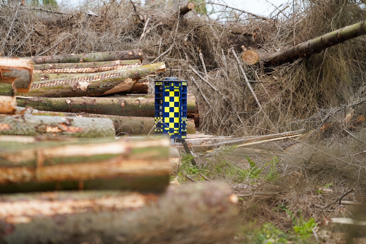 security camera in a wood pile